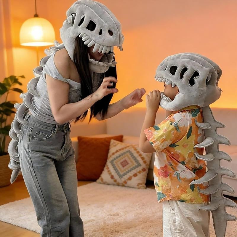Parent and child wearing the 3D dinosaur skeleton cape and skull hood, face to face