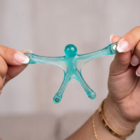 Stretching a translucent magnetic man between two hands