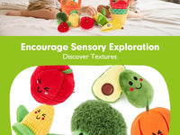Baby discovering textures on plush sensory fruits