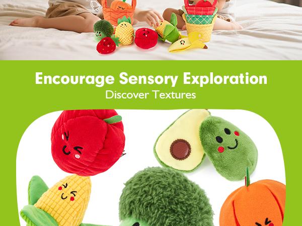 Baby discovering textures on plush sensory fruits