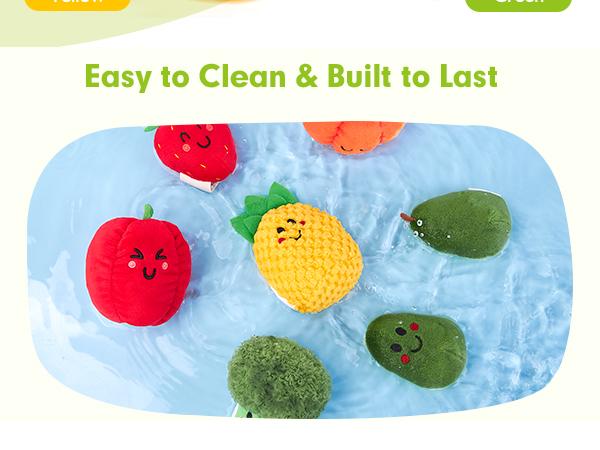 Plush play food set being cleaned in water